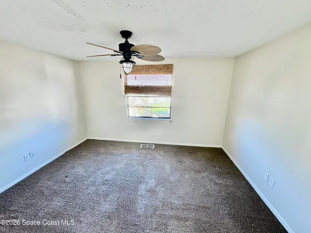 a view of a window in an empty room