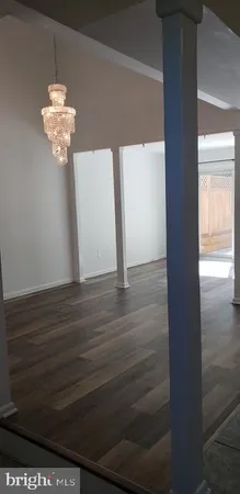 a view of a chandelier in an empty room