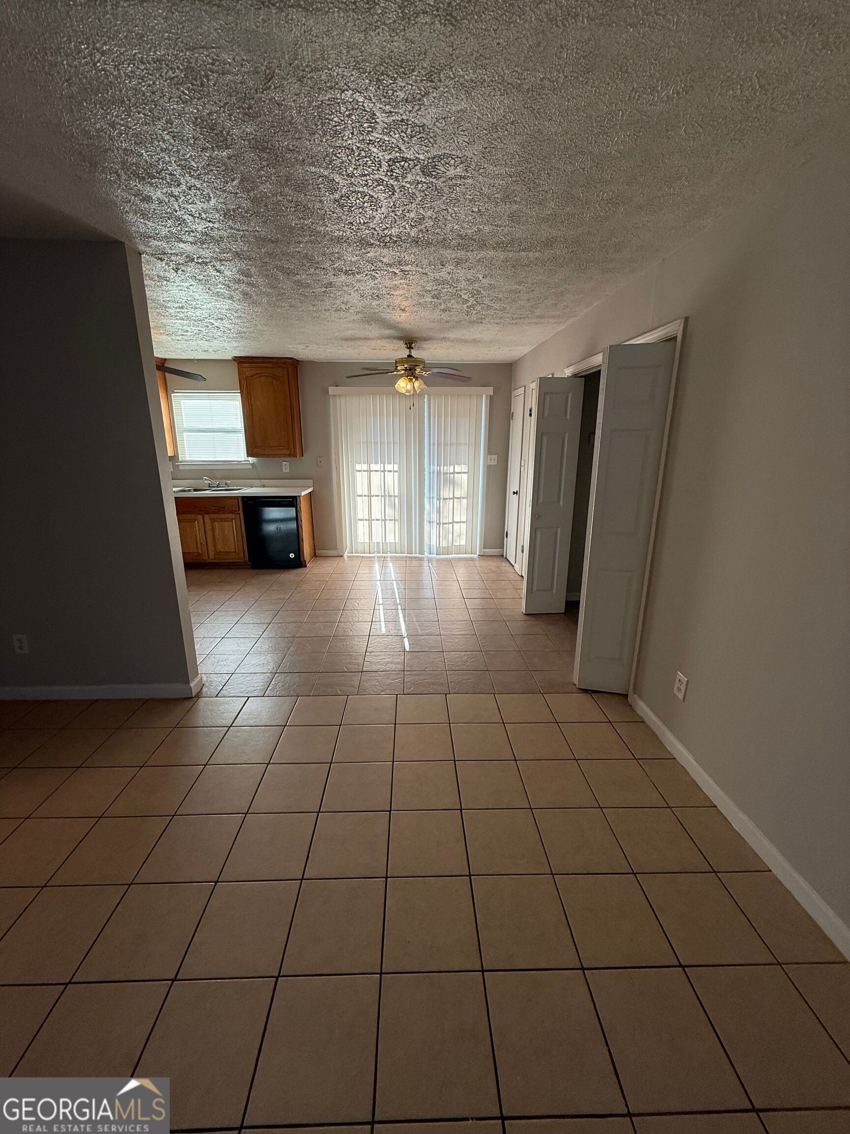 250 Toby Springs Lane McDonough, GA 30253 - Photo 4 of 10 a view of an empty room with a fireplace