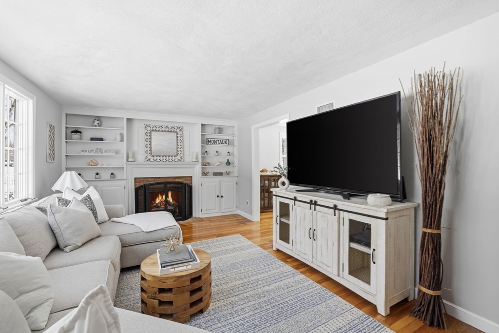 46 Brookwood Road Hanover, MA 02339 - Photo 15 of 41 a living room with furniture and a flat screen tv