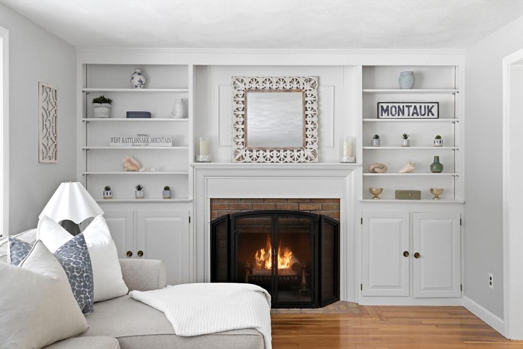 46 Brookwood Road Hanover, MA 02339 - Photo 16 of 41 a living room with furniture and a fireplace