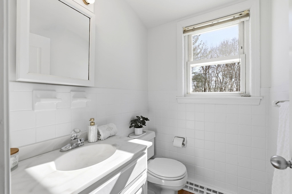 46 Brookwood Road Hanover, MA 02339 - Photo 19 of 41 a bathroom with a sink toilet and a mirror