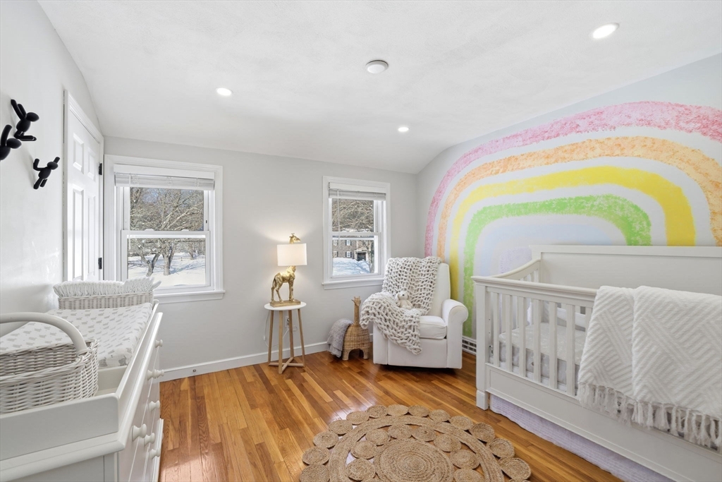 46 Brookwood Road Hanover, MA 02339 - Photo 25 of 41 a bedroom with furniture and a wooden floor