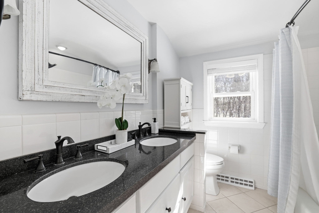 46 Brookwood Road Hanover, MA 02339 - Photo 27 of 41 a bathroom with a sink double vanity and a mirror