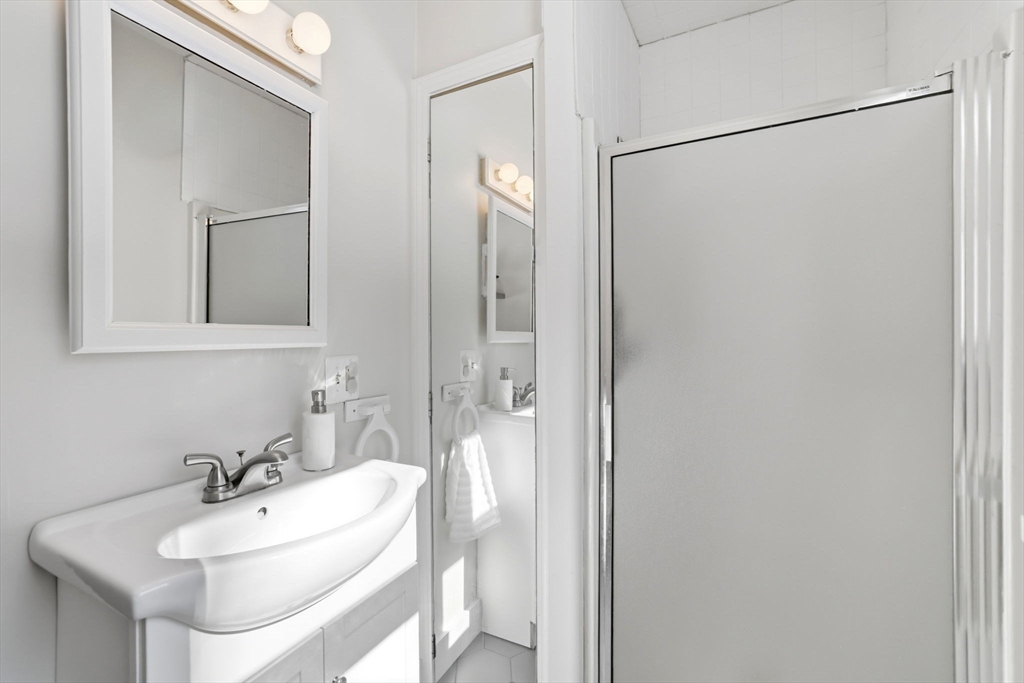 46 Brookwood Road Hanover, MA 02339 - Photo 7 of 41 a bathroom with a sink and mirror