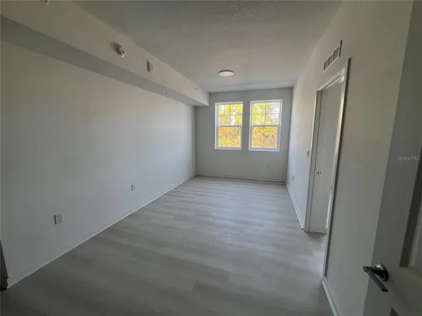 a view of an empty room with a window