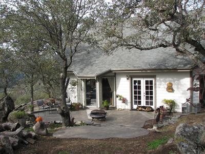 20164 Nicholas Road Prather, CA 93651 - Photo 11 of 67 From the spa steps looking back at the house (dog at back door not included :-)