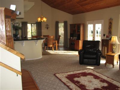 20164 Nicholas Road Prather, CA 93651 - Photo 12 of 67 Downstairs front room looking towards french door entry and kitchem
