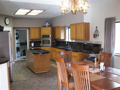 20164 Nicholas Road Prather, CA 93651 - Photo 15 of 67 Kitchen and eating area, matching marble tiled counter tops throughout home