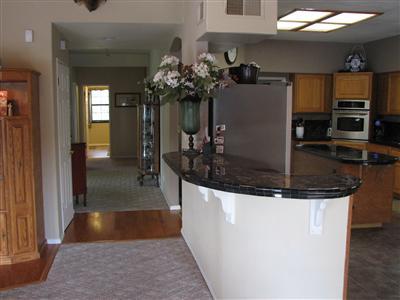 20164 Nicholas Road Prather, CA 93651 - Photo 18 of 67 Breakfast bar and hallway to office nook and two bedrooms and hall bath