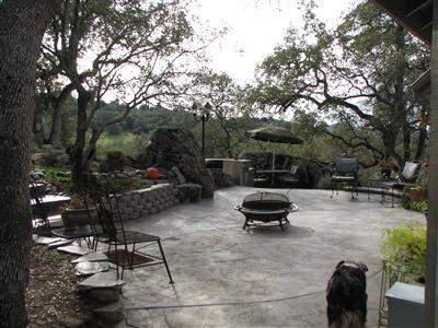 20164 Nicholas Road Prather, CA 93651 - Photo 6 of 67 Patio with steps to spa area, showing how you can have a central fire and the outdoor kitchen is located at the other end of this patio