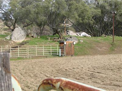 20164 Nicholas Road Prather, CA 93651 - Photo 60 of 67 Arena with view to seating area on the hillside