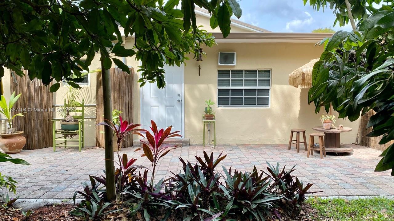 20230 Southwest 184th Street Miami, FL 33187 - Photo 21 of 42 Private Entrance to the in-law suite of the house, with sitting area outside, also gives you access to the laundry room.