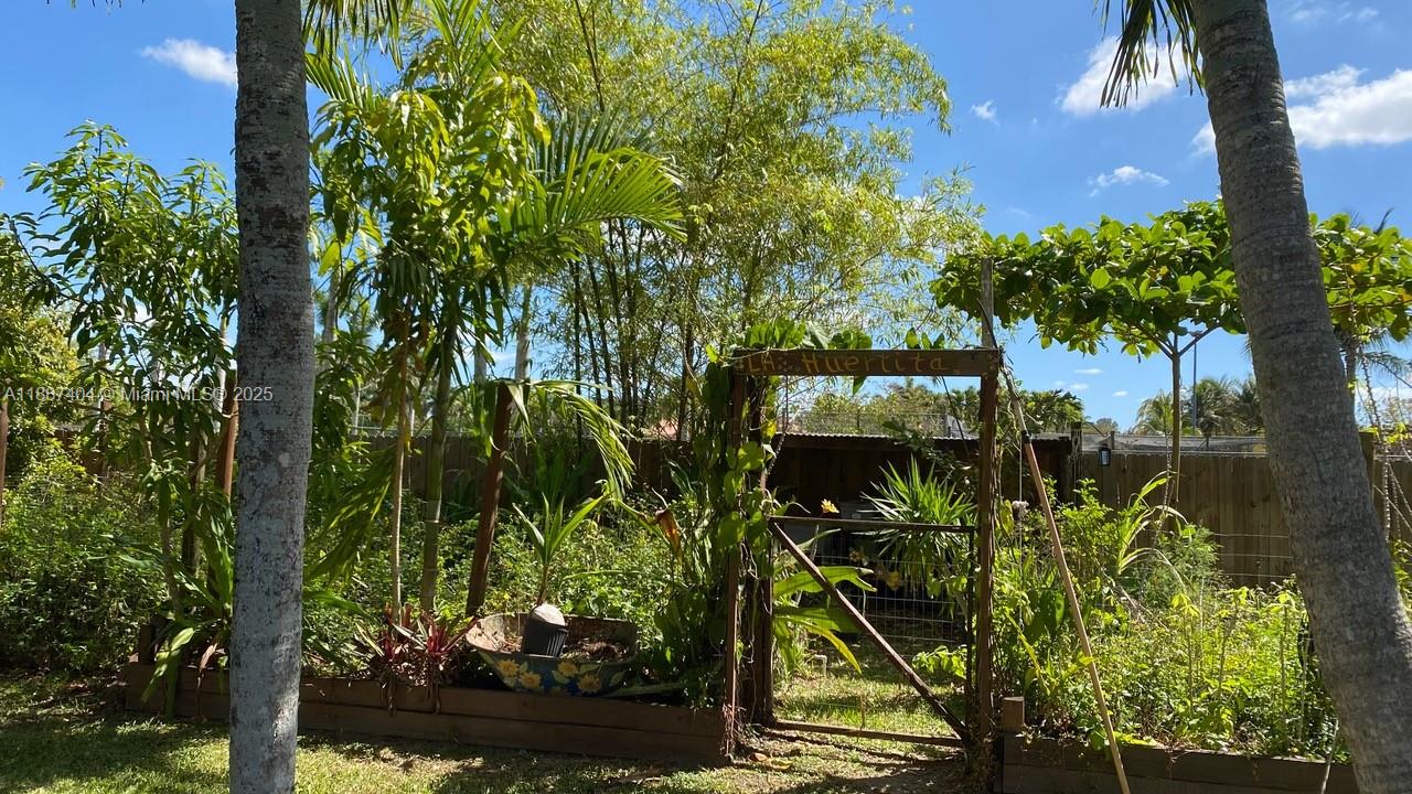 20230 Southwest 184th Street Miami, FL 33187 - Photo 31 of 42 The entrance to the organic veggie garden