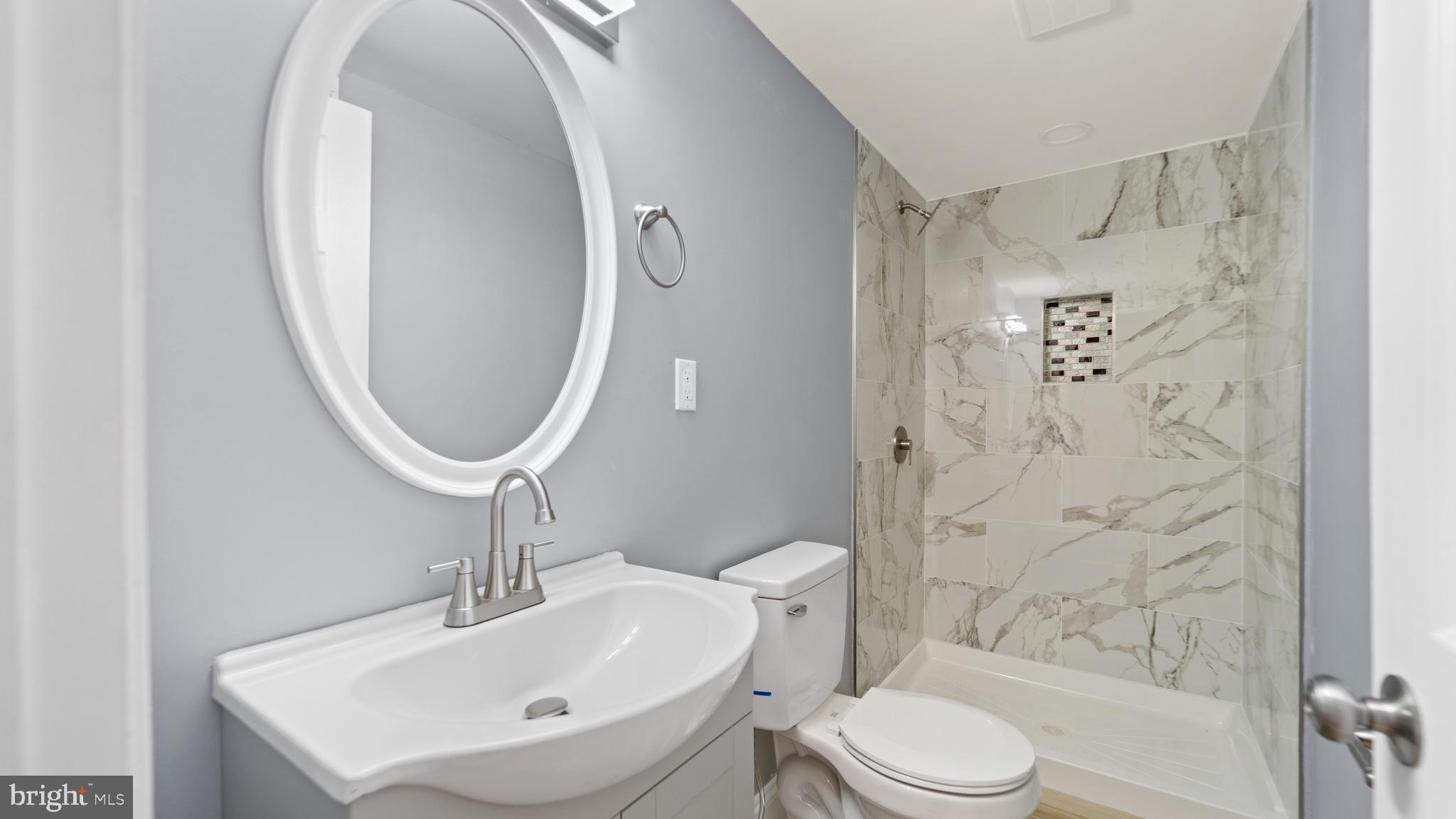 3605 Chapman Road Randallstown, MD 21133 - Photo 48 of 65 a bathroom with a sink toilet and shower