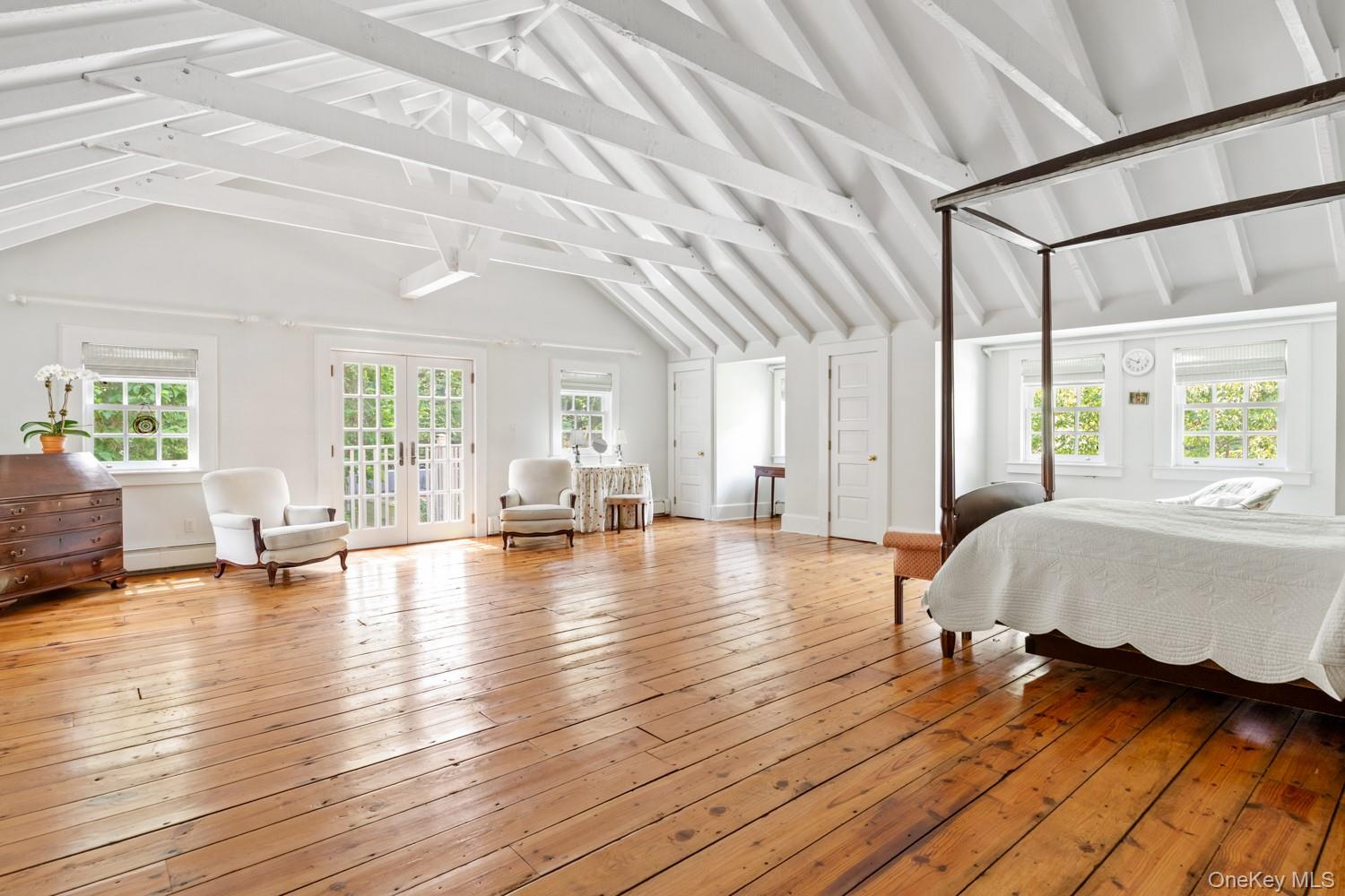 62 Cove Neck Road Cove Neck, NY 11771 - Photo 13 of 25 Primary featuring Wood Floors, High Vaulted ceiling, and Balcony