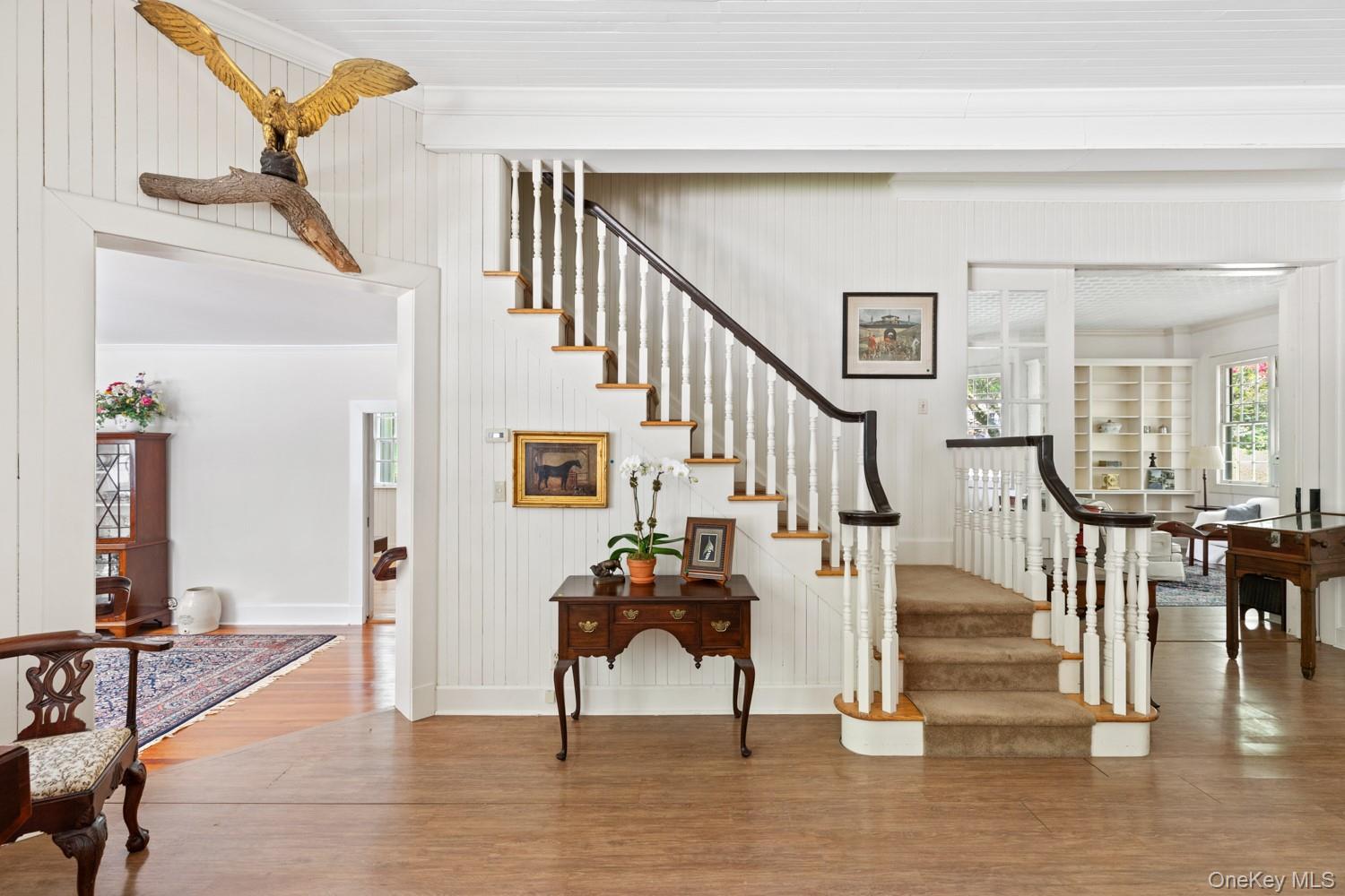 62 Cove Neck Road Cove Neck, NY 11771 - Photo 2 of 25 Stairs to Second Floor. Entry Foyer and Library Views