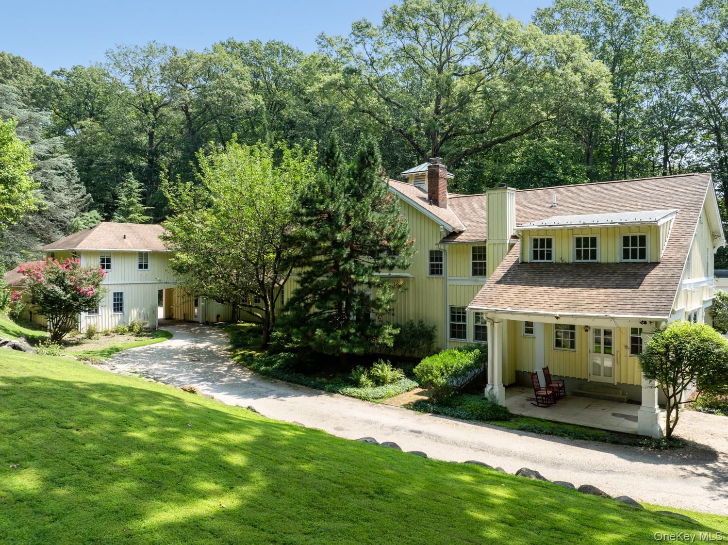 62 Cove Neck Road Cove Neck, NY 11771 - Photo 21 of 25 View of side of home featuring porch, additional driveway to Cottage