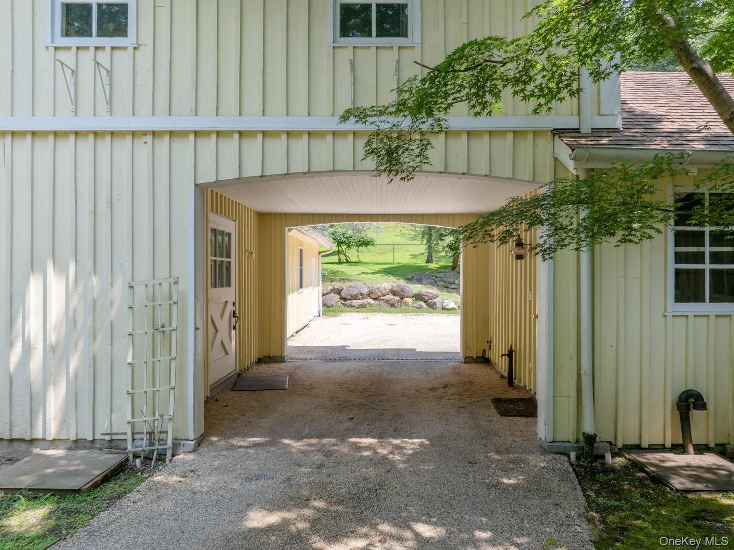 62 Cove Neck Road Cove Neck, NY 11771 - Photo 23 of 25 View of parking / parking lot featuring an exterior structure