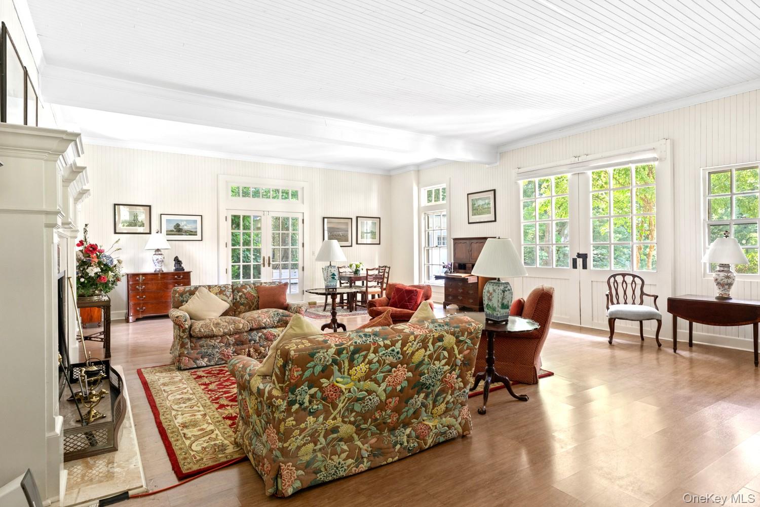 62 Cove Neck Road Cove Neck, NY 11771 - Photo 4 of 25 Living Room with Original Carriage Doors, High Ceilings