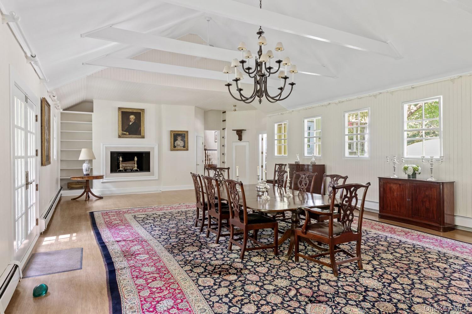 62 Cove Neck Road Cove Neck, NY 11771 - Photo 6 of 25 Dining area with plenty of natural light and Fireplace