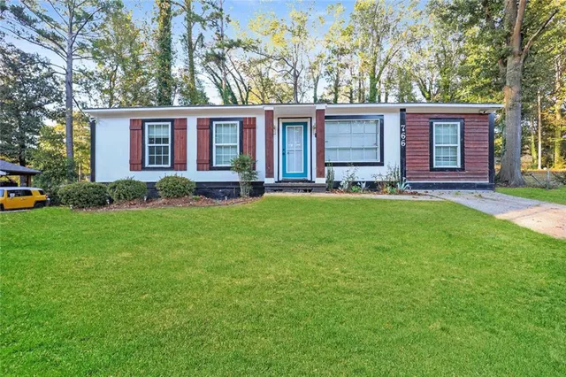 front view of a house with a yard