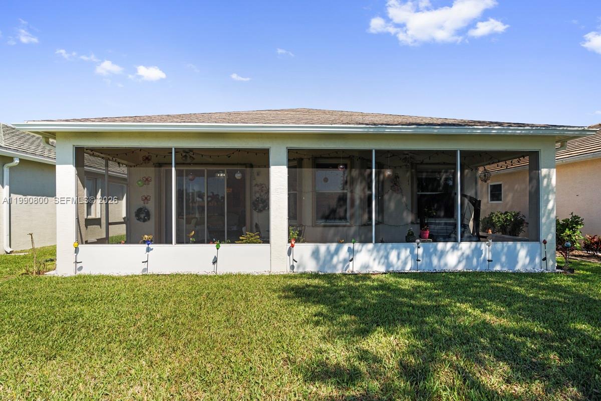 337 Southwest Maclay Way Port St. Lucie, FL 34986 - Photo 40 of 44 a view of a house with a large garden area and garden