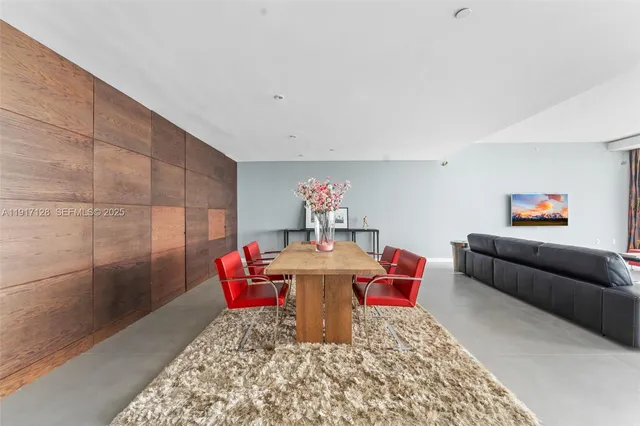 a living room with furniture and a rug