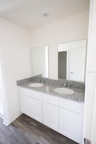 a bathroom with a shower and a sink
