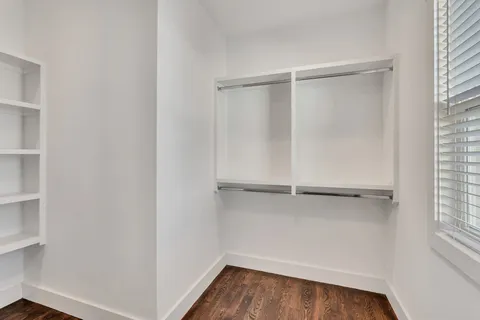a view of an empty walk in closet