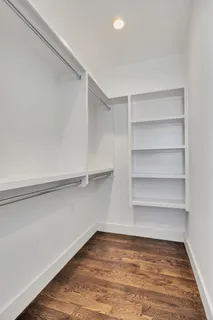 a view of a room with shelf on the wall
