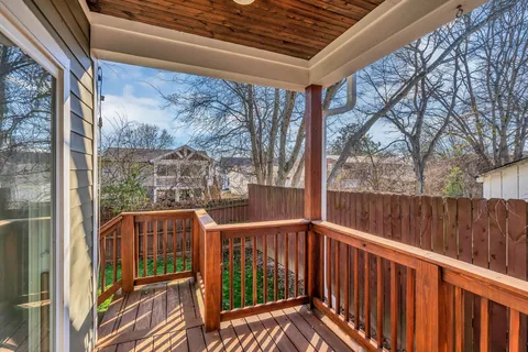 a view of balcony with wooden floor