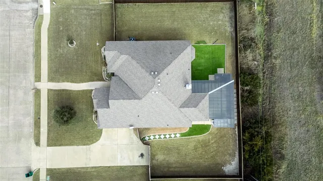 an aerial view of a house with a garden