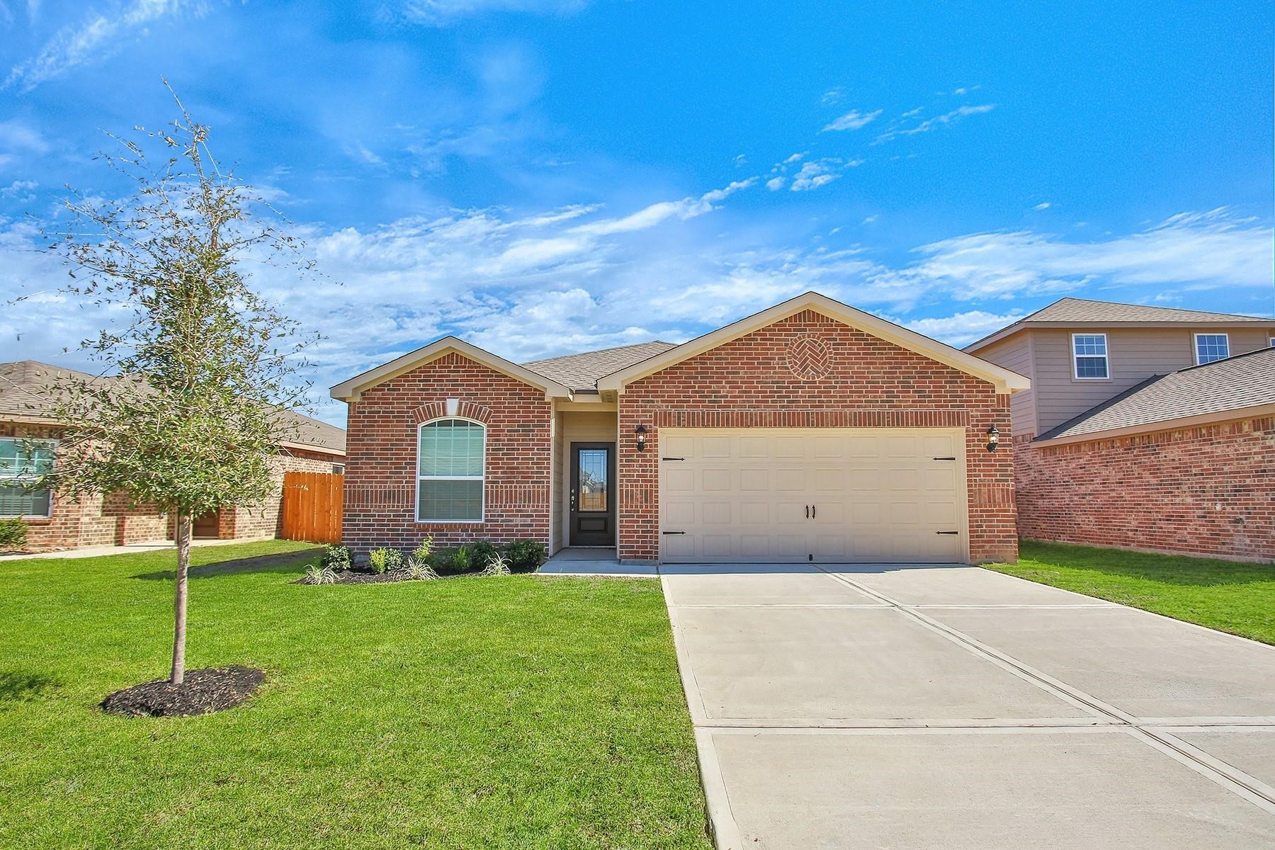 22422 Kennons Way Hockley, TX 77447 - Photo 1 of 11 a front view of a house with a yard and garage