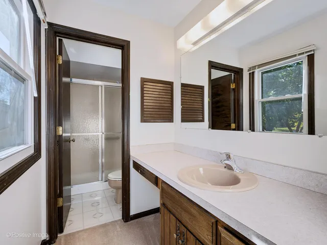 a bathroom with a sink and a large mirror