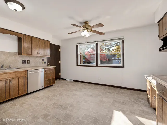 a kitchen with a cabinets and window