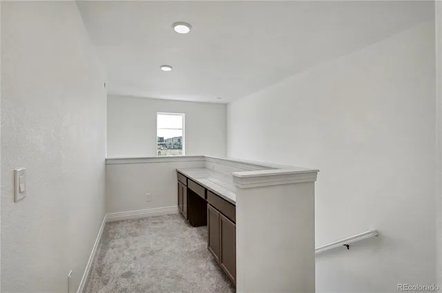 a kitchen with a stove and a refrigerator