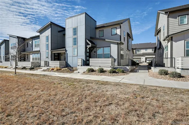 a view of a house with snow on the road
