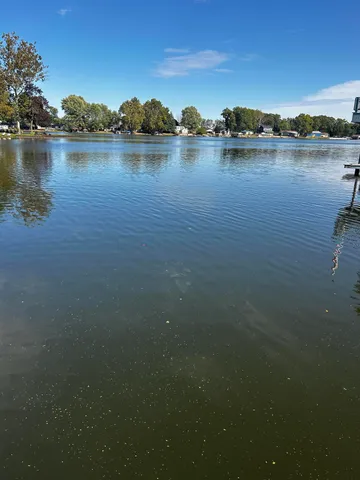 a view of a lake with a city view