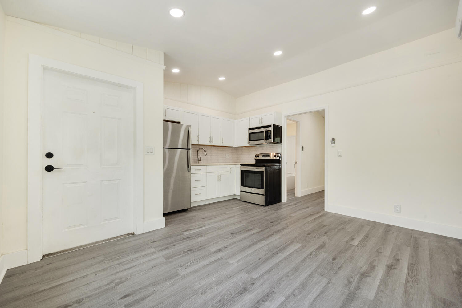5331 Southeast Ebbtide Avenue Stuart, FL 34997 - Photo 13 of 24 a view of kitchen with stainless steel appliances a refrigerator and wooden floor