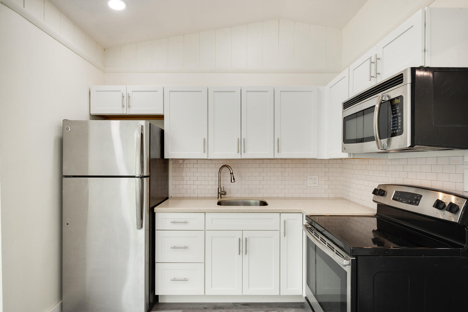 5331 Southeast Ebbtide Avenue Stuart, FL 34997 - Photo 17 of 24 a kitchen with a refrigerator sink and microwave