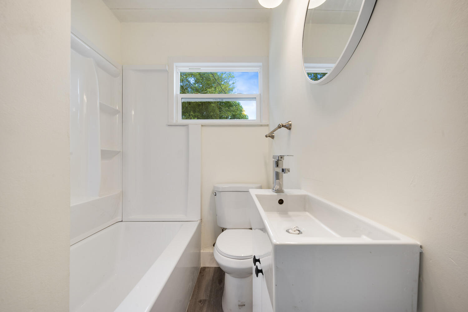 5331 Southeast Ebbtide Avenue Stuart, FL 34997 - Photo 20 of 24 a bathroom with a sink a toilet and a bathtub