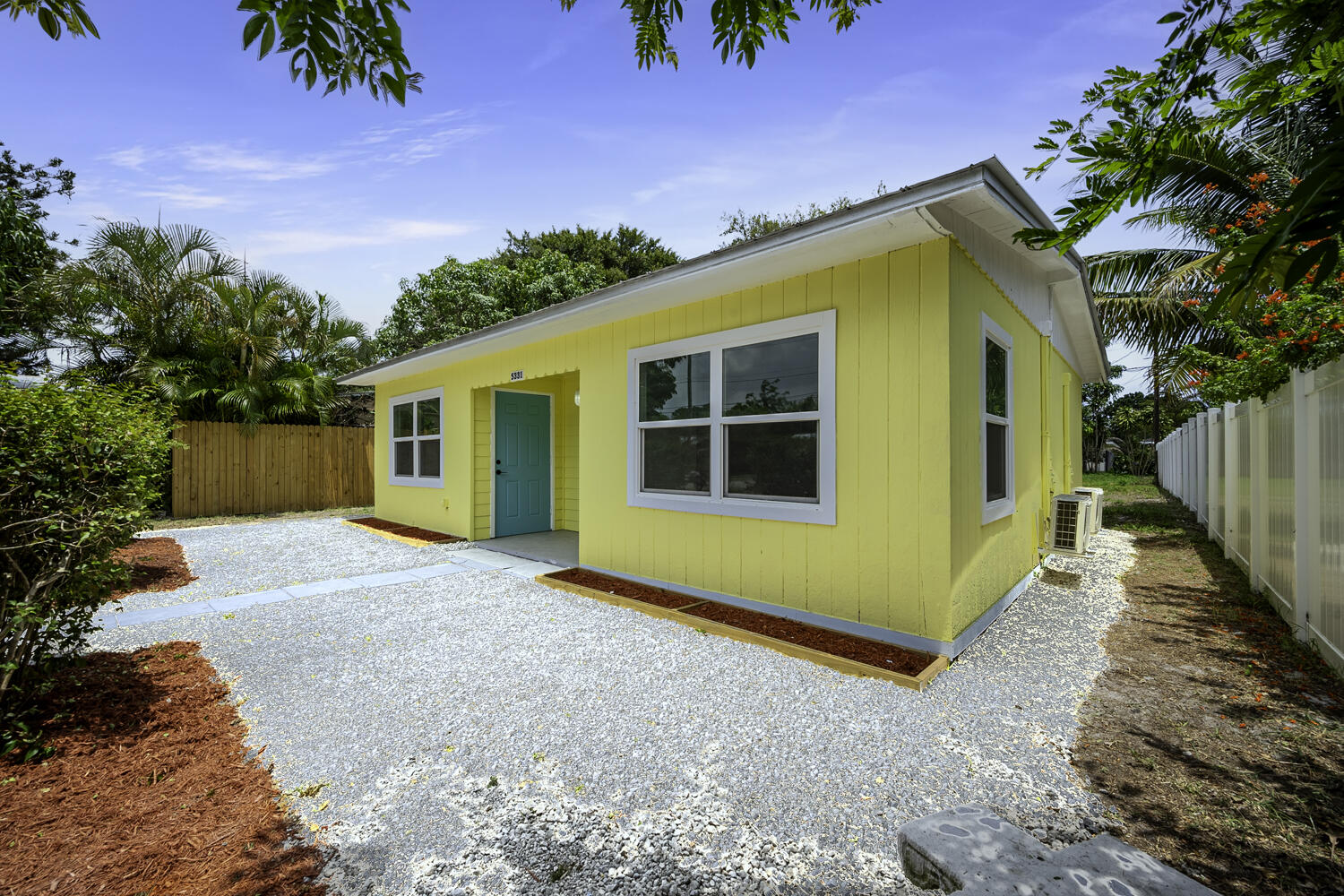5331 Southeast Ebbtide Avenue Stuart, FL 34997 - Photo 4 of 24 a view of a house with a backyard