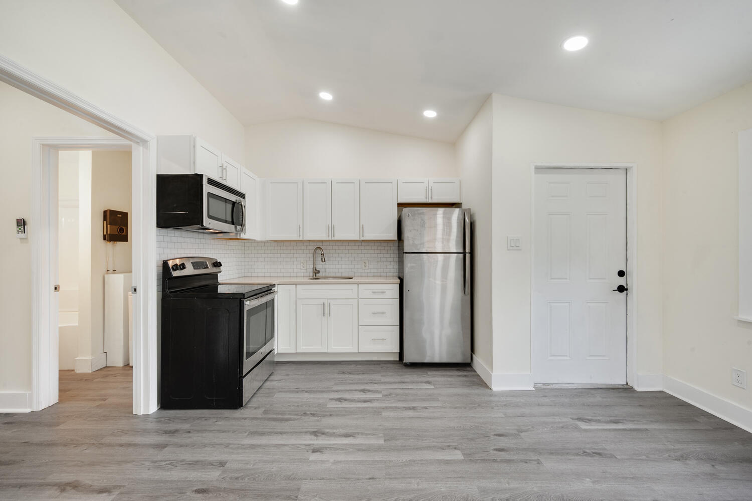 5331 Southeast Ebbtide Avenue Stuart, FL 34997 - Photo 5 of 24 a kitchen with a refrigerator and a stove top oven