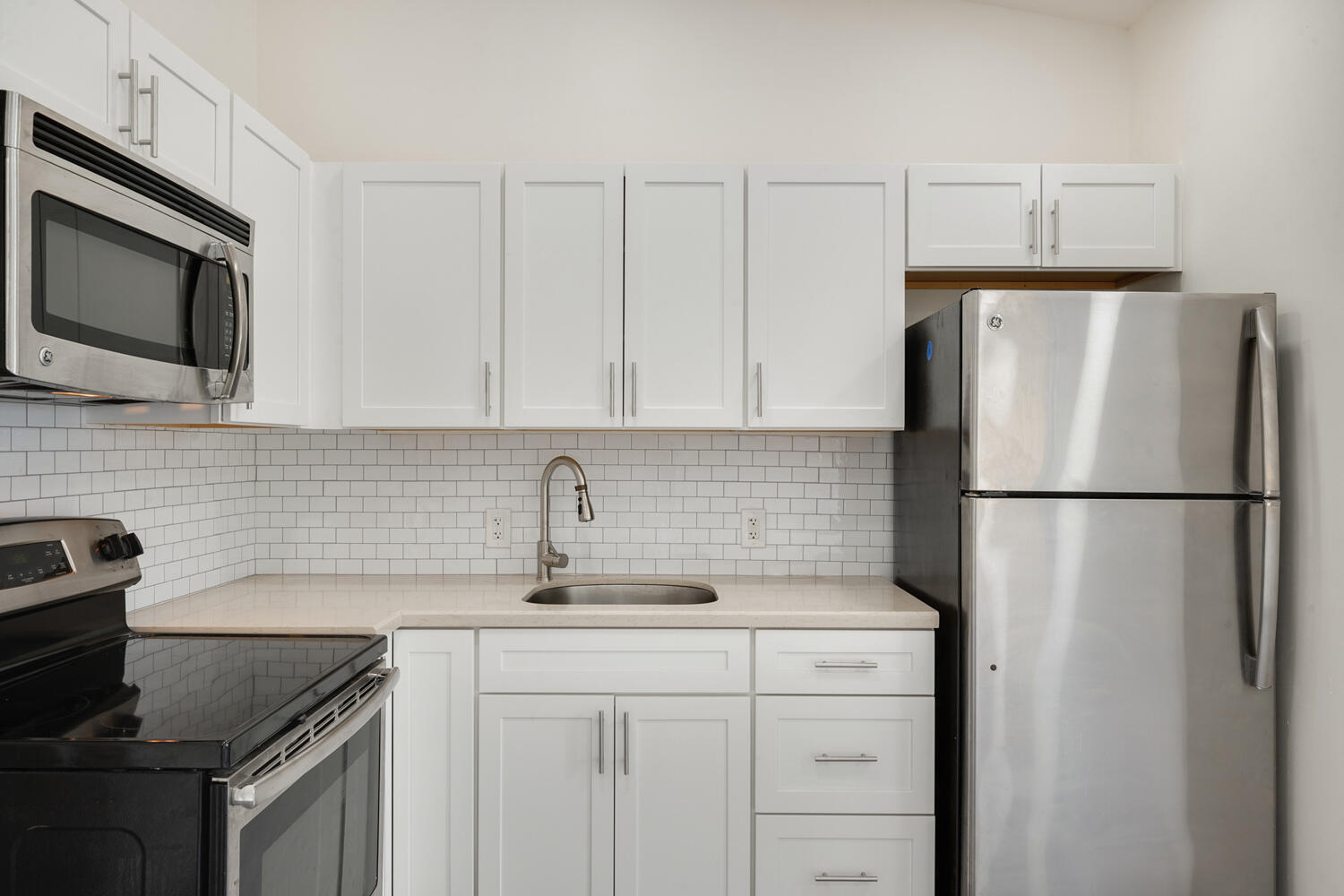5331 Southeast Ebbtide Avenue Stuart, FL 34997 - Photo 7 of 24 a kitchen with appliances a sink and cabinets