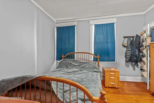 a bedroom with furniture and a window