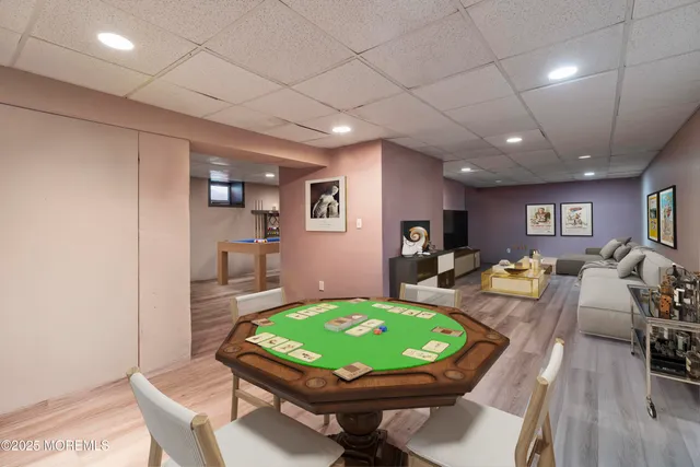 a view of a dining room with a table and chairs