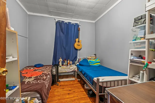 a bedroom with furniture and a book shelf