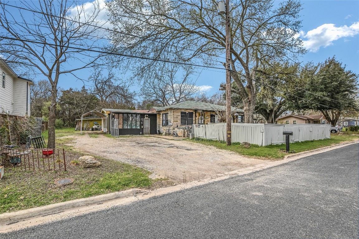 5405 Prock Lane Austin, TX 78721 - Photo 2 of 13 a view of a house with a yard and large trees