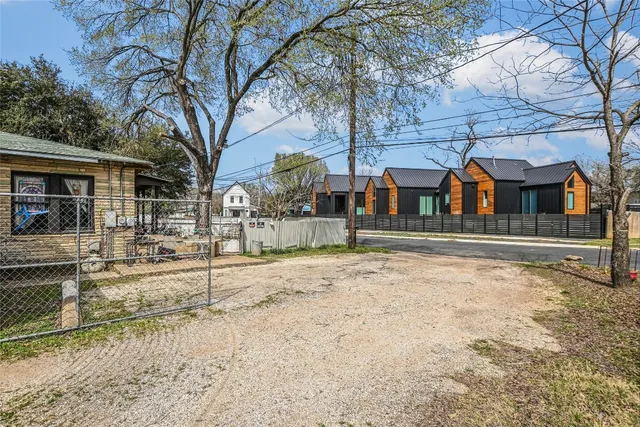 a view of a house with backyard porch and sitting area